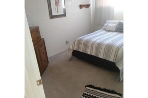 Full size bed, closet, hangers, dresser, and storage