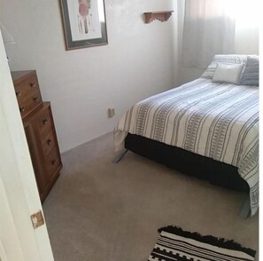 Full size bed, closet, hangers, dresser, and storage