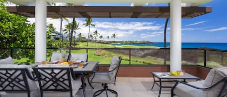 Enjoy meals on the covered lanai with ocean and sunset views