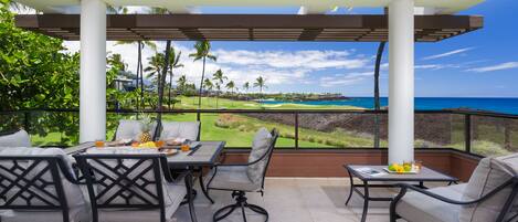 Enjoy meals on the covered lanai with ocean and sunset views