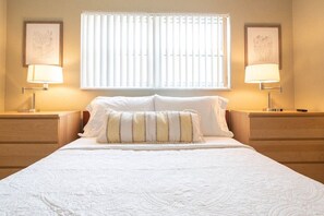 The bedroom includes a queen size Casper memory foam mattress wrapped in high end linens and adorned with plush pillows.