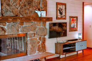 Fireplace, TV, and shiplap wall