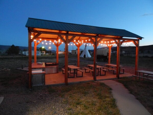 Outdoor pavilion with plenty of sitting and grill