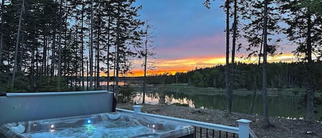 Relax in the hot tub while catching the sunset