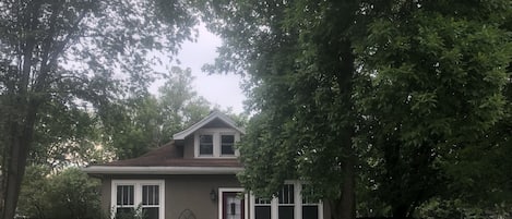 View of the front of the property. Entrance off driveway located off the alley.