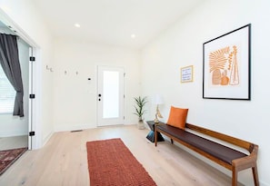 Entry Way with Decor and Bench Seating to Take Your Shoes Off