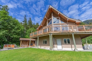 Outside of house hot tub is now located under window on the left side