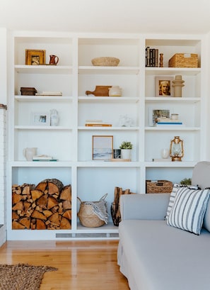 Open Shelving decorates this cozy corner of the living room