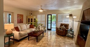 Comfortable seating for 6 in Living Room with door to the patio.