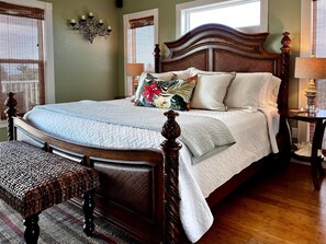 Master bedroom with stately king sized bed, closet, master bath, private deck.