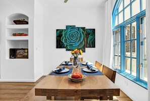 Dining area with PB Solid-wood dining table and chairs with seating for 6.