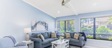 Modern living room furnishings in pretty baby blue!  Cable TV included.