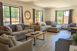 Main living room with so much seating... TV, poker table, and sofa sleeper