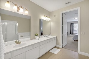 Dual vanity en-suite bathroom off master bedroom