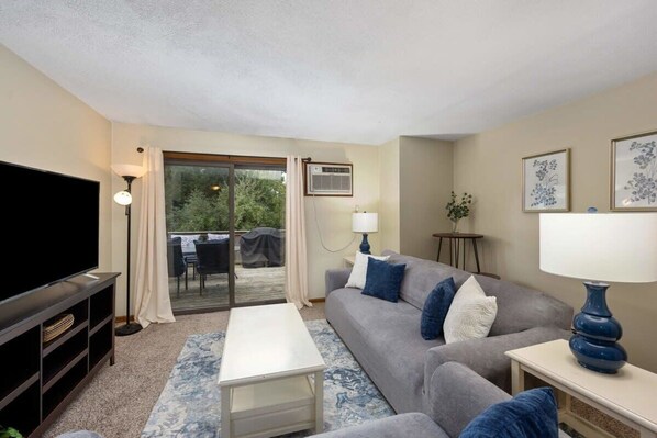 Cozy living space with smart tv & ample seating