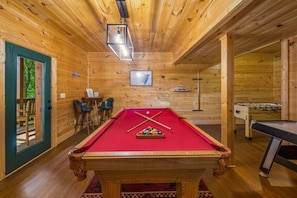 Game room with pool table, and air hockey, foosball.
