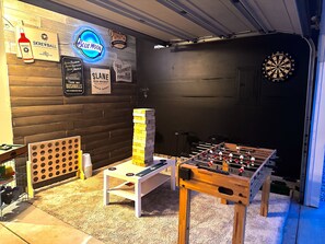 Game room equipped with foosball, jumbo Jenga, jumbo Connect 4, darts and more!