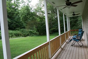 Enjoy a cup of coffee or glass of wine on the long southern-style porch