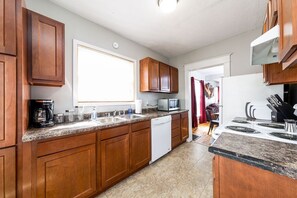 Laundry Room is located to the right along with the back door.