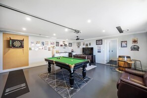 The whole family will enjoy being together, especially in the games room with a pool table, darts, and foosball.