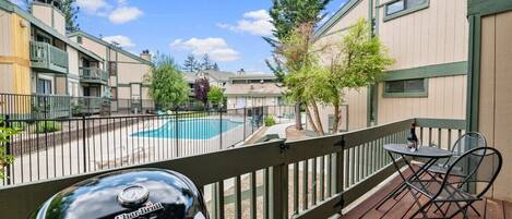 Step out the sliding door to extended deck. Pool View.