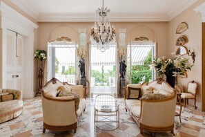 The beautifully decorated living room, opening onto the terrace