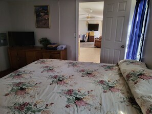 Master Bedroom. King Bed.  With view of living room.