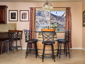 Dine at our one-of-a-kind reclaimed barrel glass top table with picturesque mountain views.