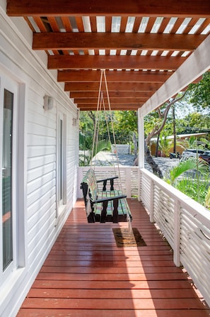At entry of villa you cannot miss this beautiful swing hand painted with Macaus