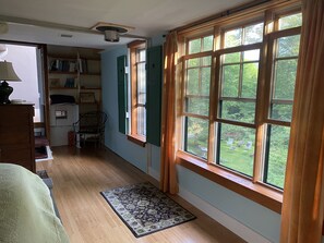 Windows across from queen bed