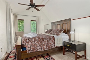 Our lofted bedroom features a Queen-size bed, luxe linens and bedding, and a cozy seat - perfect for an afternoon reading.