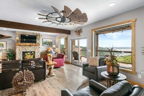 The lake views are perfectly framed by the large windows in the living space.