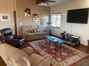 Living room with fan, DVD player, and Amazon fire stick