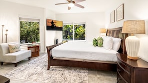Primary bedroom with Cal King bed, TV and Ceiling Fan