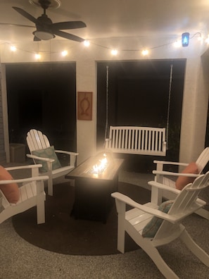 Propane fire pit, porch swing, and relaxation.