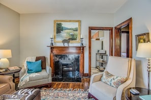 The living room also has a beautiful faux fireplace.