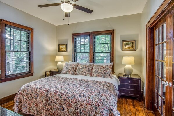 Primary bedroom has a king size bed and TV. 