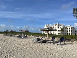 Private Beach with loungers and shade less than 1.5 mins from door to sand.