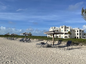 Private Beach with loungers and shade less than 1.5 mins from door to sand.