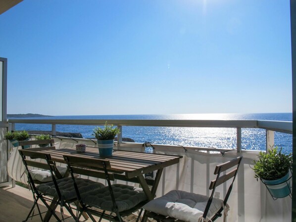 Sky, Water, Table, Plant, Property, Building, Furniture, Chair, Flowerpot, Shade