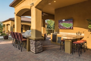 Quality outdoor kitchen with large outdoor TV