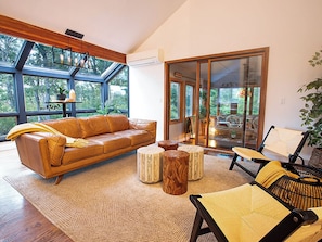 Cape Cod Villa's living room. Enjoy the warmth of the fireplace and pond views