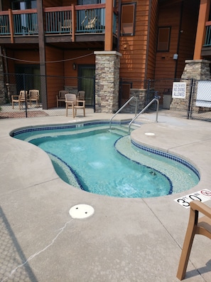 Hot tub located outside patio to your left