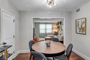 Separate dining space with space for gathering for meals or games.