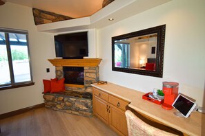 Coffee station, desk area, fireplace and TV