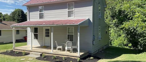 Blue Ridge Rest front porch, sitting area, faces gravel road and parking spot