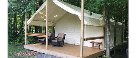 Exterior of the 15x20 Cana Tent and Breakfast safari platform tent. 