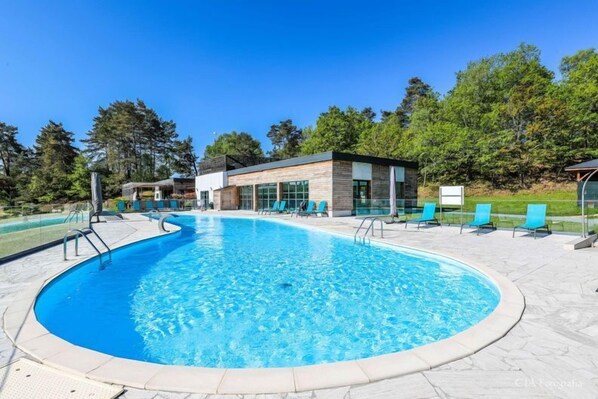 Lounge by the pool in the sunshine.