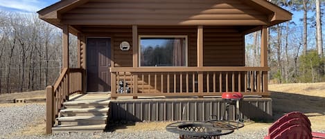 front of cabin with covered porch 