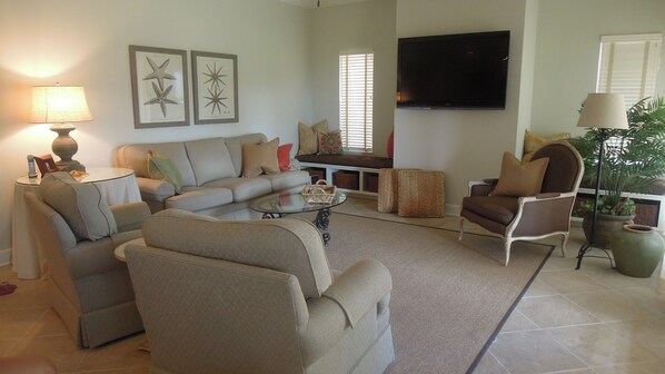 Living area with view to patio. New Plasma TV with Blu-Ray DVD and Cable.